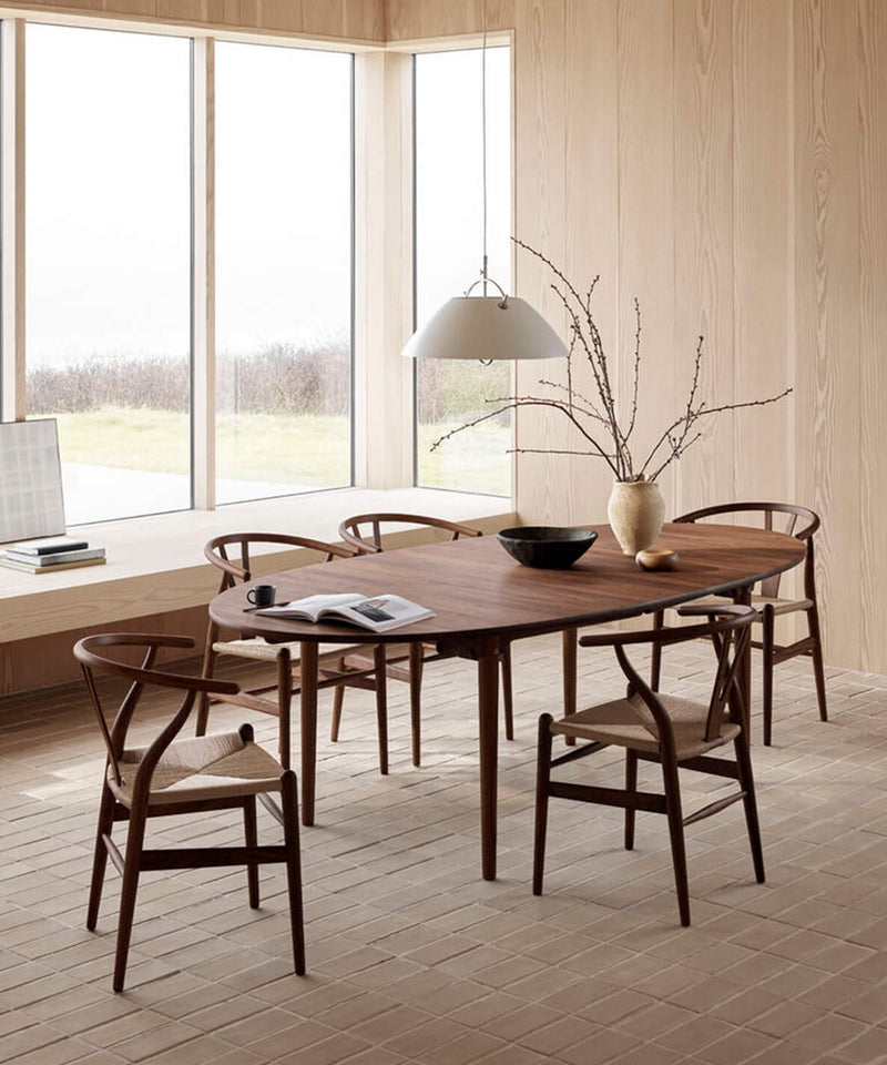 Dining room with CH24 chairs and a wooden dining table