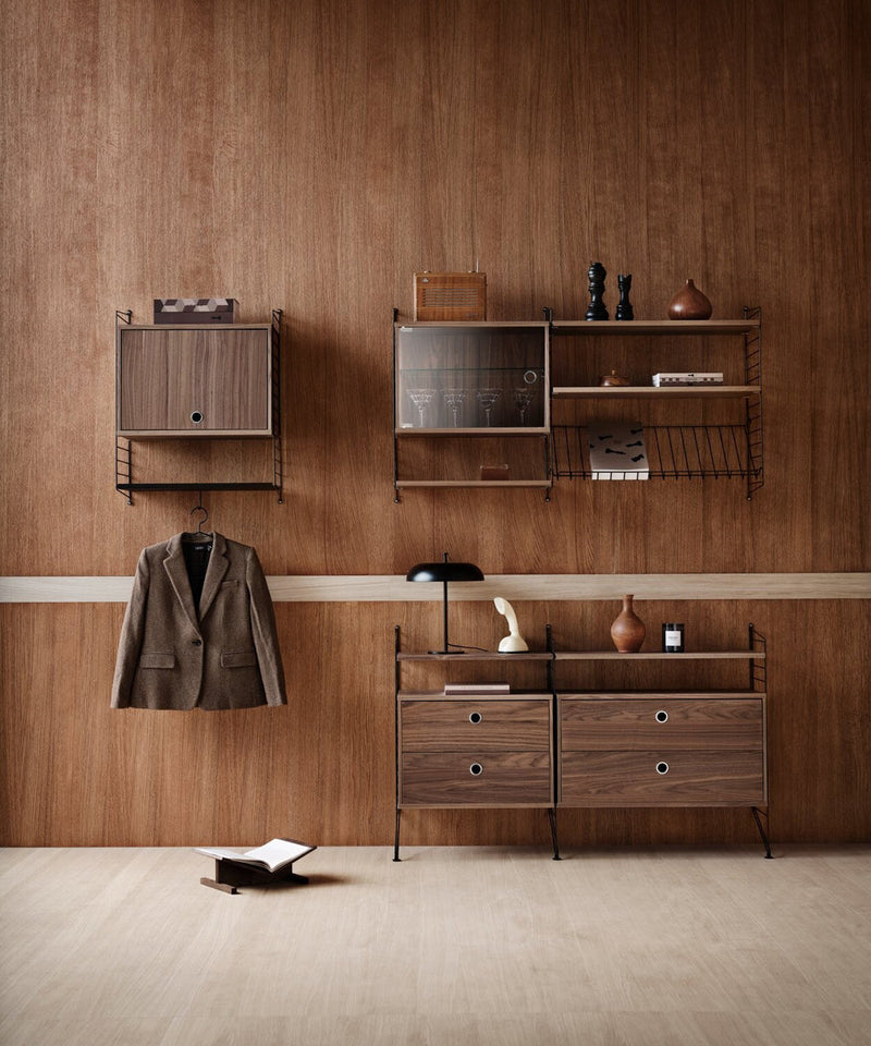 Image of the String Furniture shelving system in a dark wood