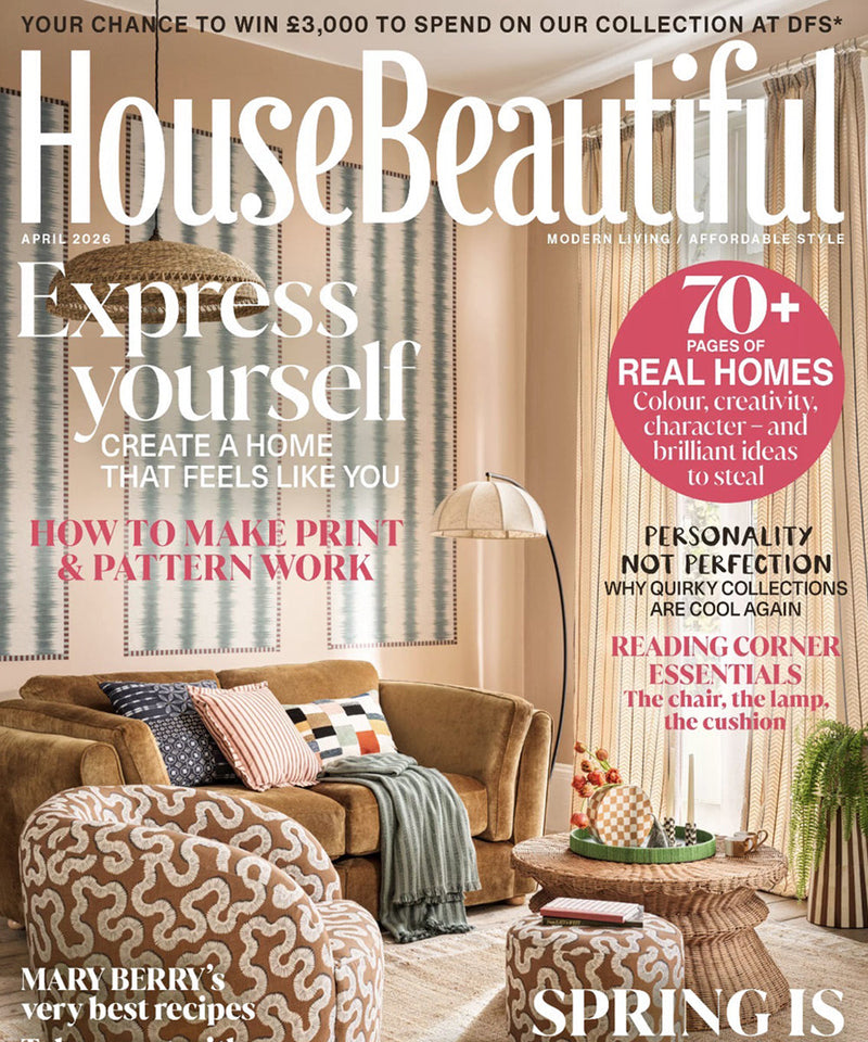 The cover of April 2026 edition of House Beautiful Magazine showing a luxury living room featuring lighting and furniture