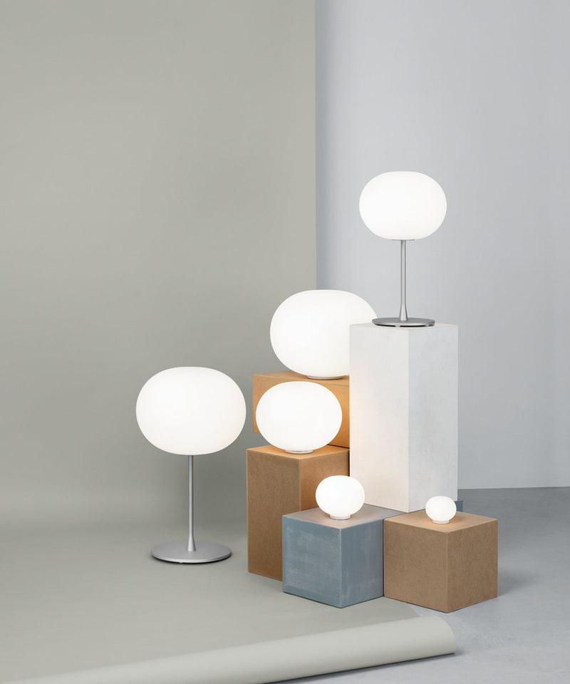 A collection of the Flos Glo-Ball table lamps in a range of sizes